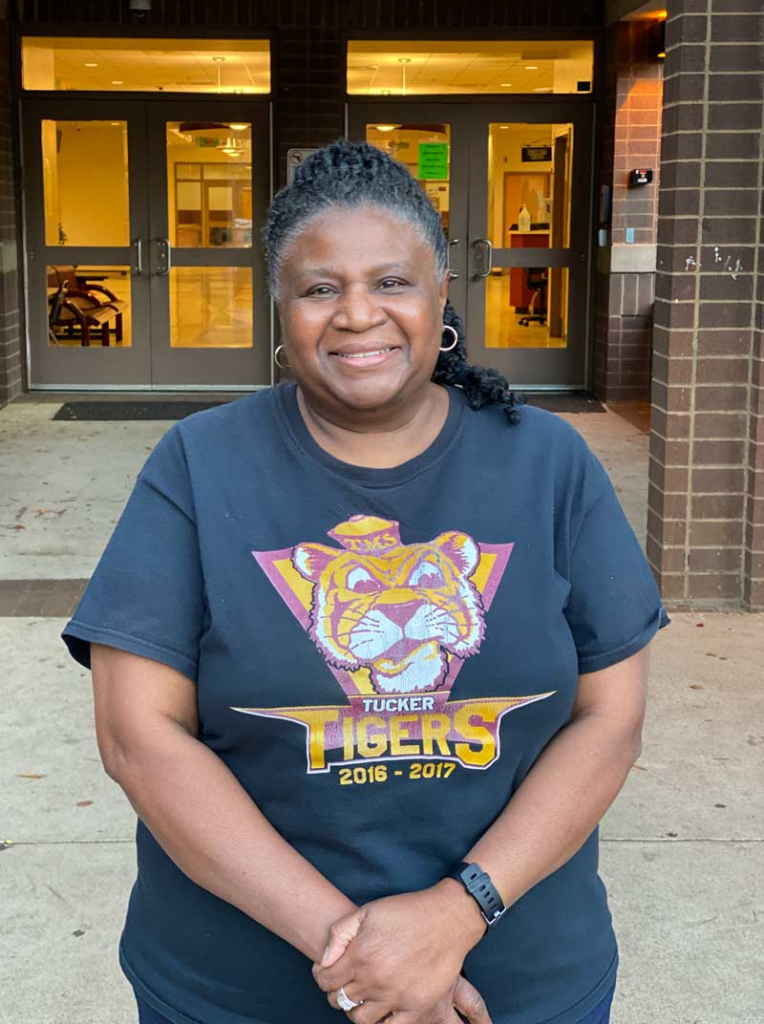 Cunningham in front of the school she is retiring from