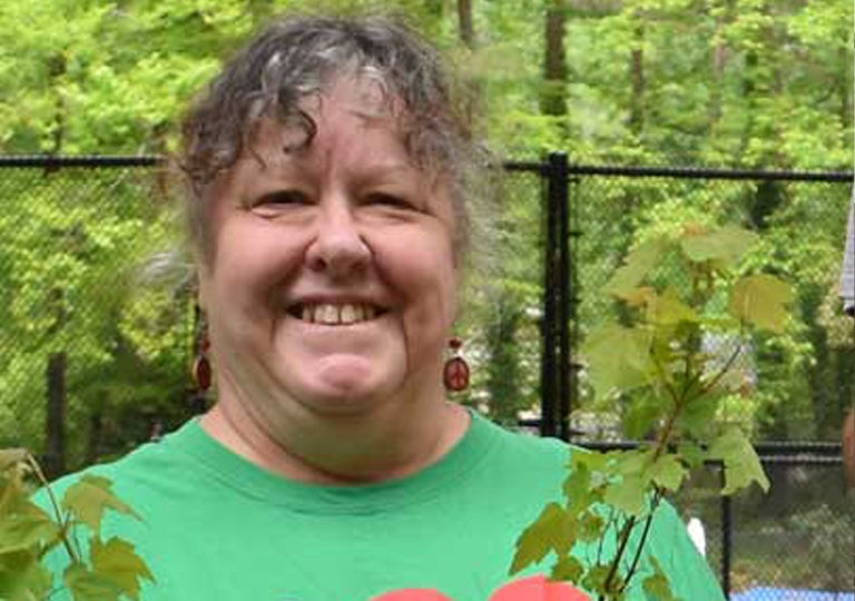 Vicki Ward Warren older white woman with peace sign earrings citizen of the month