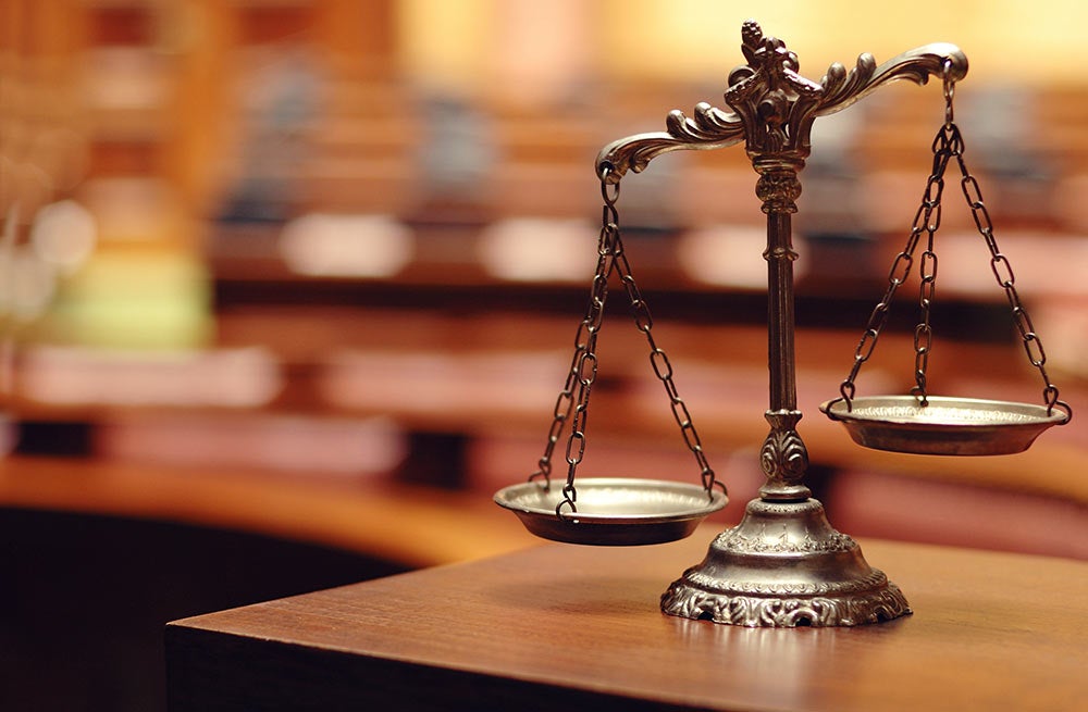 Decorative Scales of Justice in a Courtroom.