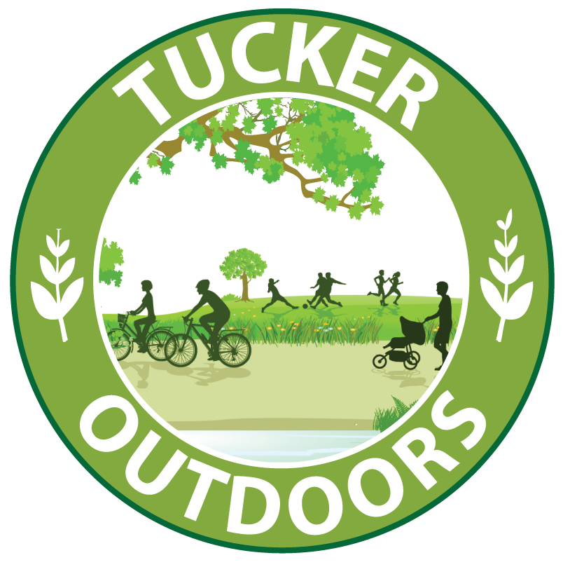 Tucker Outdoors logo with trees and people playing games.