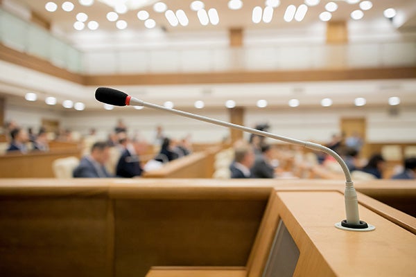 Close-up image of a microphone on a podium.