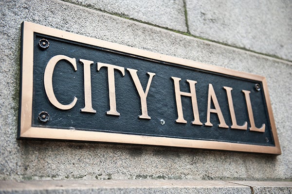 Sign on side of building which reads City Hall