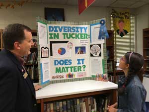 Blue ribbon on white board presentation from student