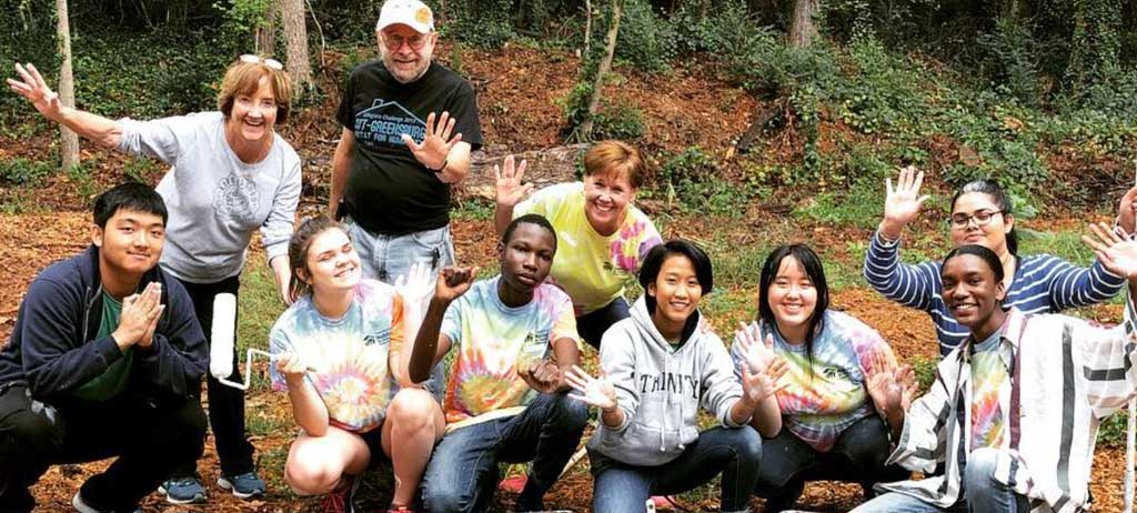 Team of Habitat Volunteers sit for group photo