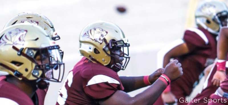 Tucker High School football players in action