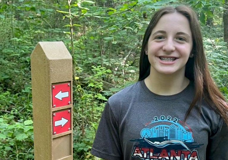 Abigail Heizer teenage in Atlanta 2022 t shirt on a trail citizen of the month