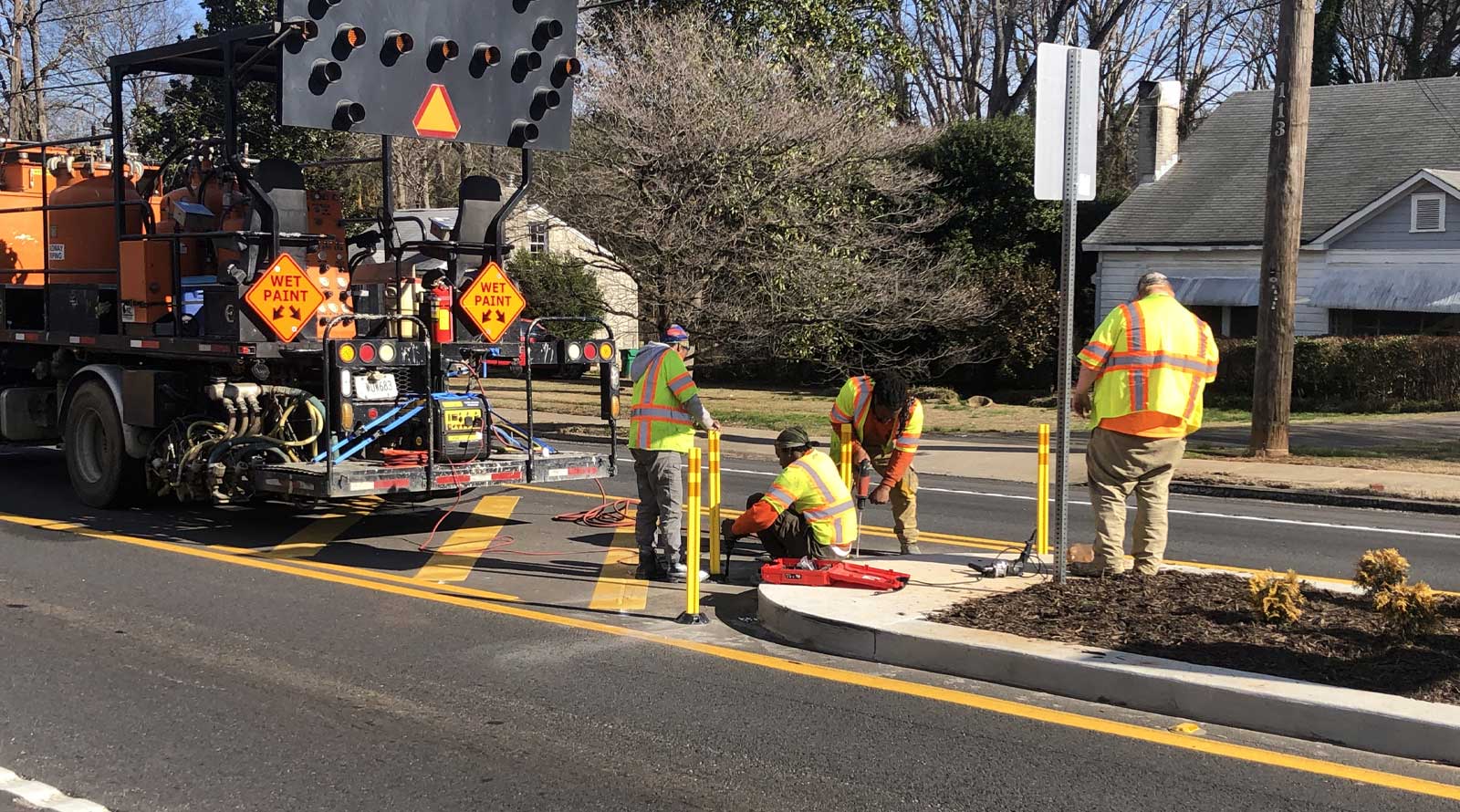 Crew installing traffic medians on Chamblee-Tucker Road.