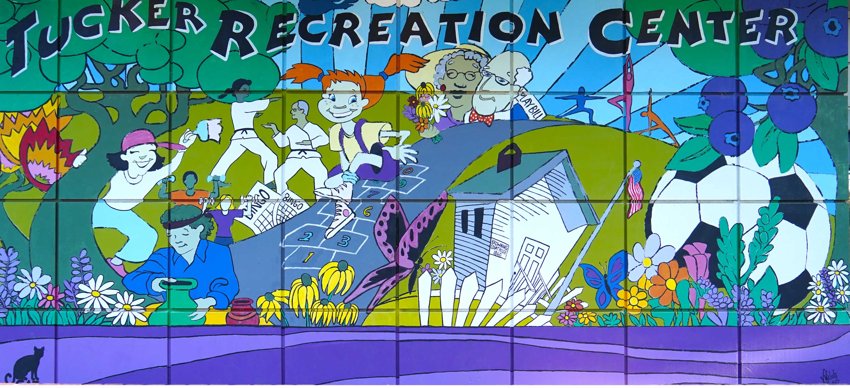 Tucker Recreation Center mural of kis playing in the park, bingo soccer and the elderly watching a play and other activities