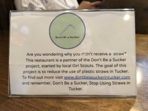 Picture of a "Don't Be A Sucker" card at a restaurant