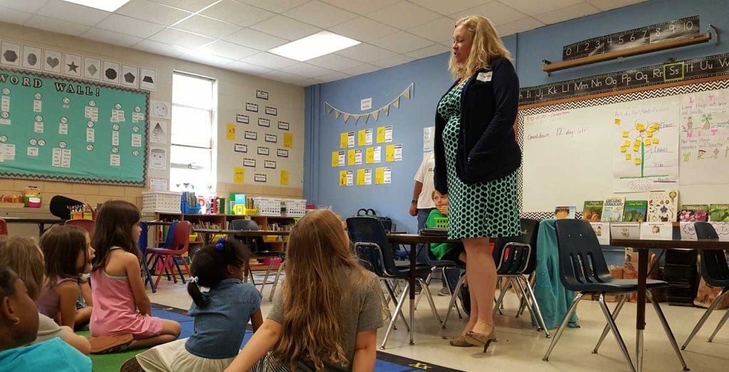 An adult speaking to students about STEM