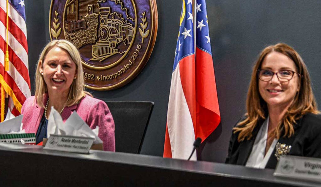 Term-limited councilmembers Anne Lerner and Noelle Monferdini at their final Council meeting.