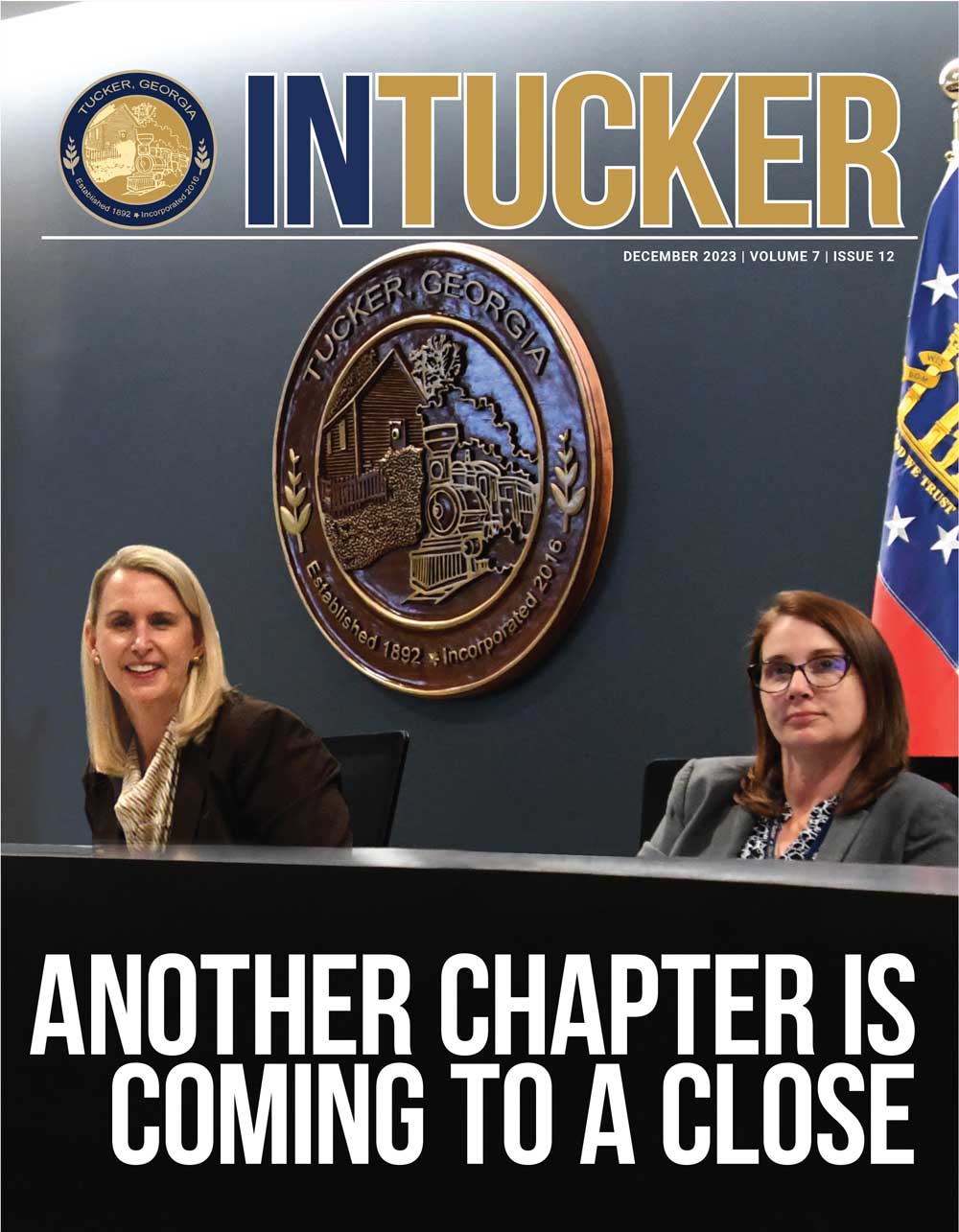 December cover shows Anne Lerner and Noelle Monferdini at the dias.