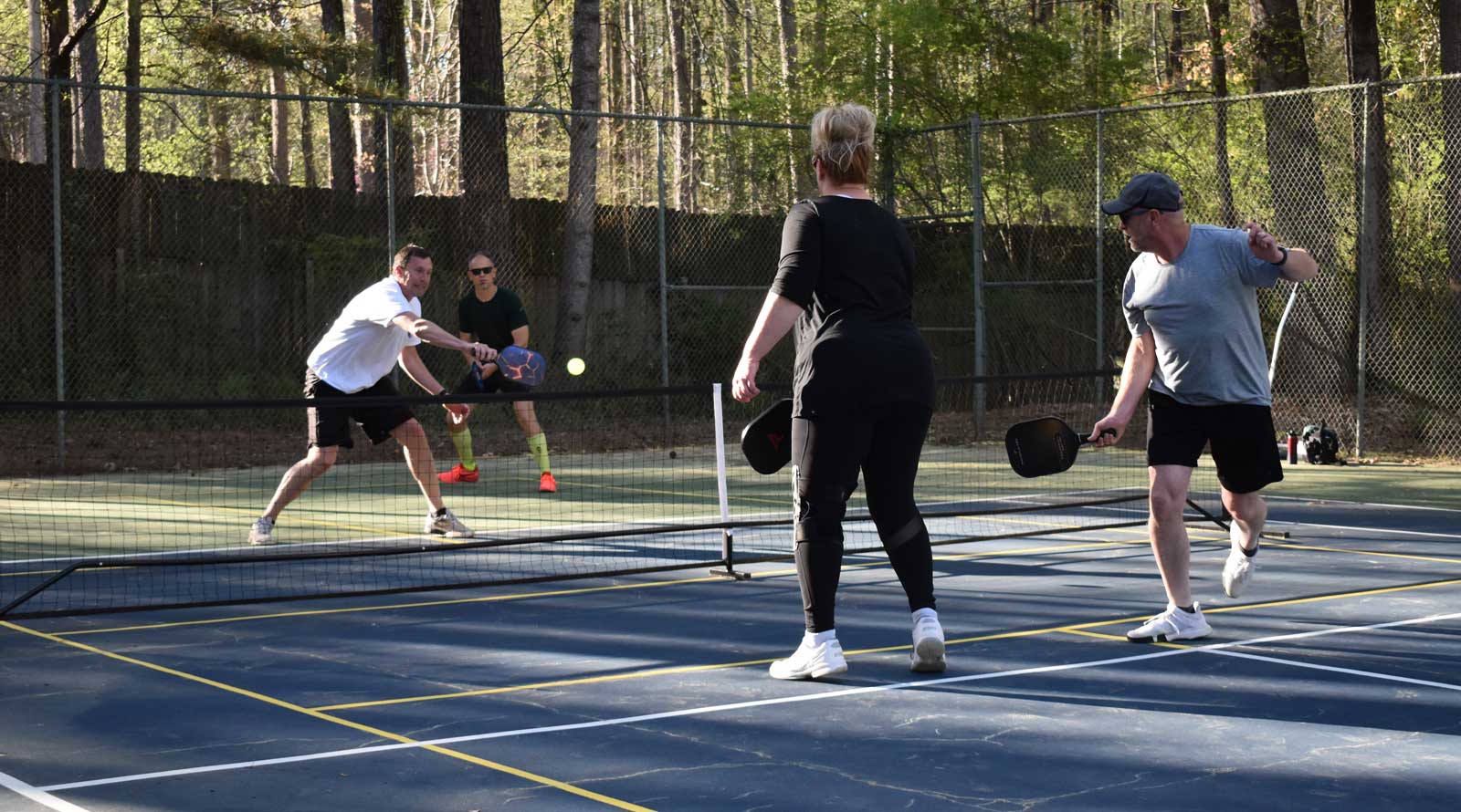 couples playing pickleball