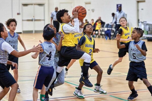 Young boys play basketball at Tucker Recreation Center