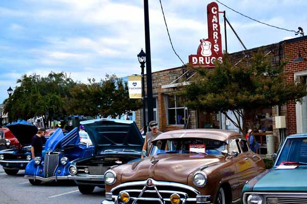 50s style cars displayed in downtown