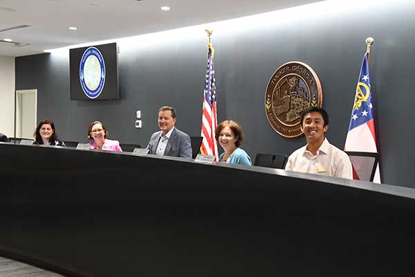 May and city council in meeting