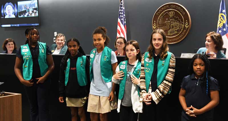 Students from Globe Academy lead the Pledge of Allegiance.